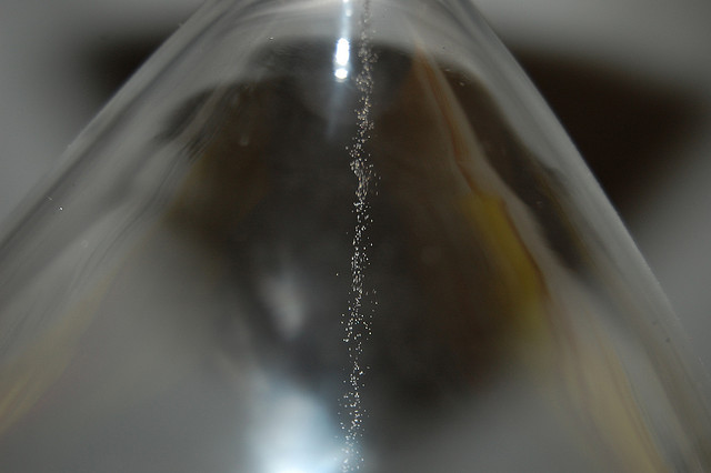 A stream of sand in an hourglass
